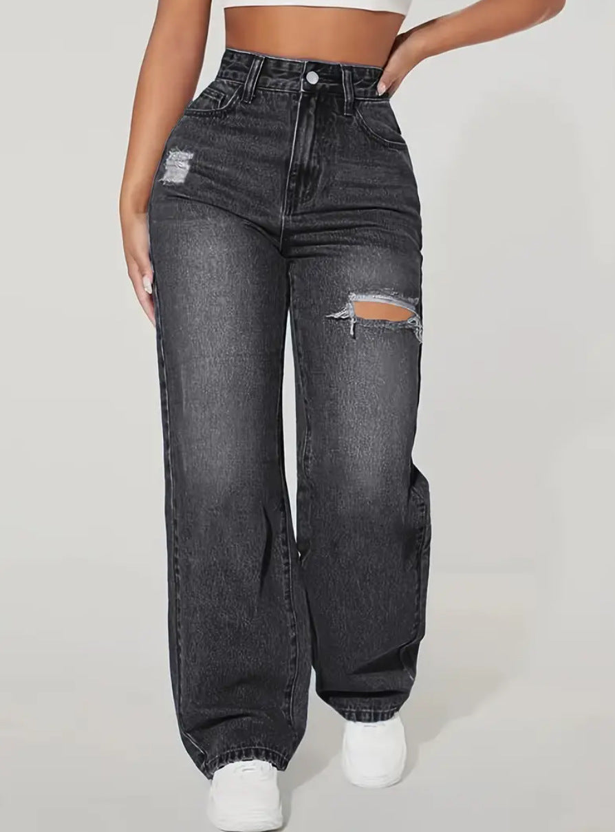 women washing water ripped denim trousers
